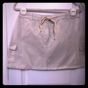 Express skirt above the knees.